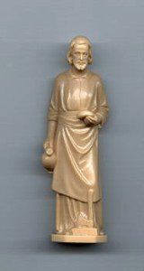Beige statue of a standing religious figure.
